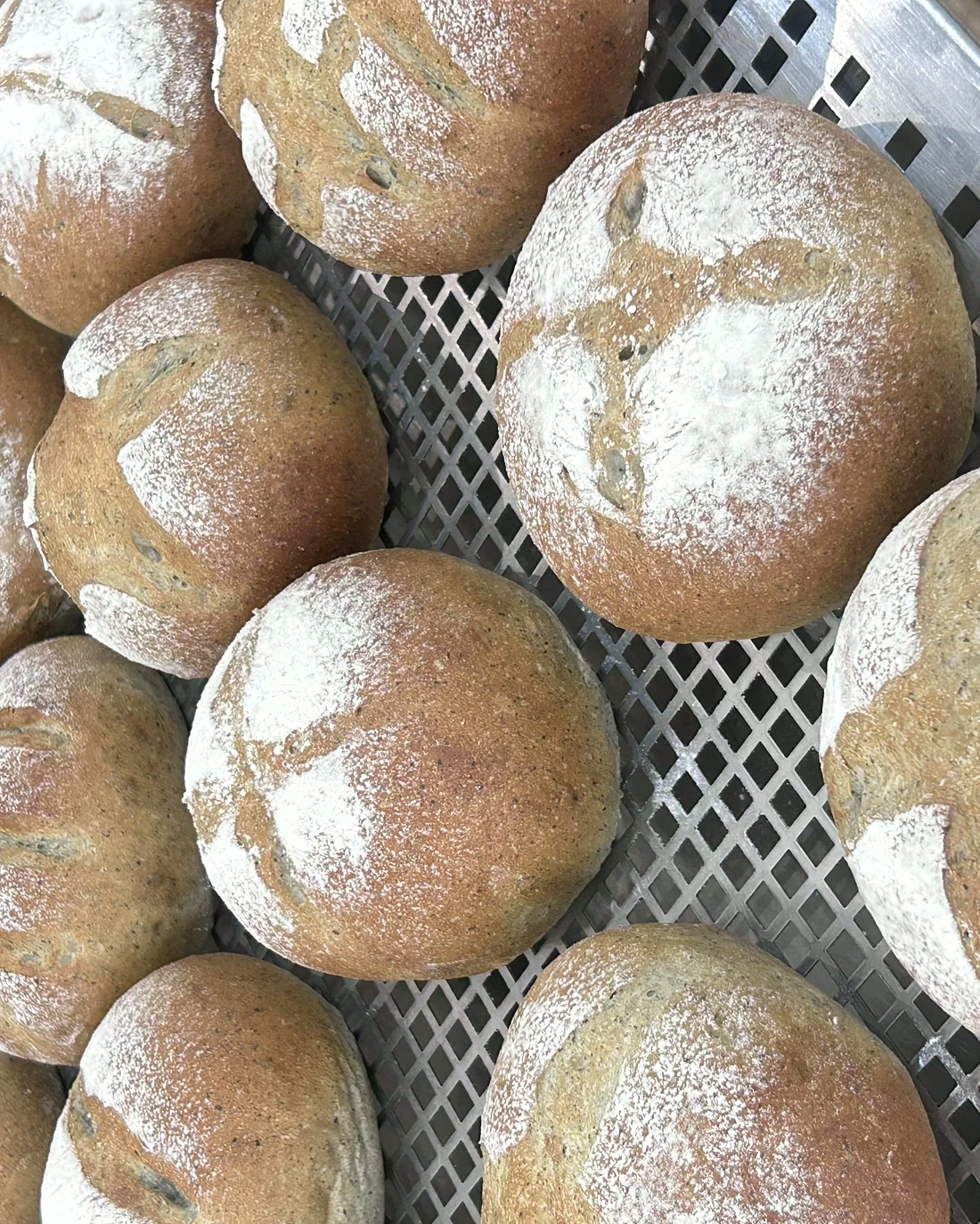 Real BWC finished bread assortment cooling on racks at JWC Academy