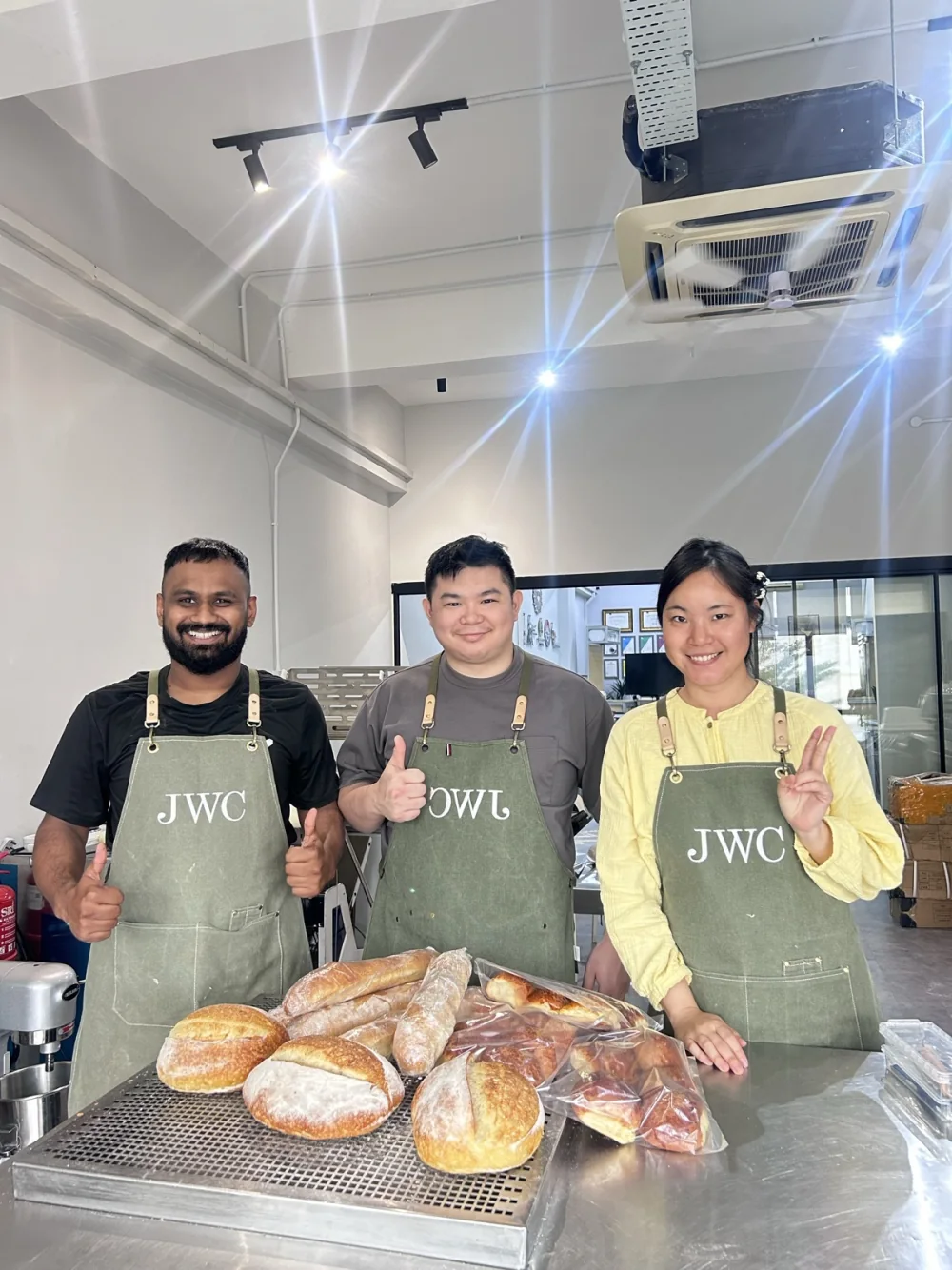 Siew Wei and BWC learners presenting bread made during class