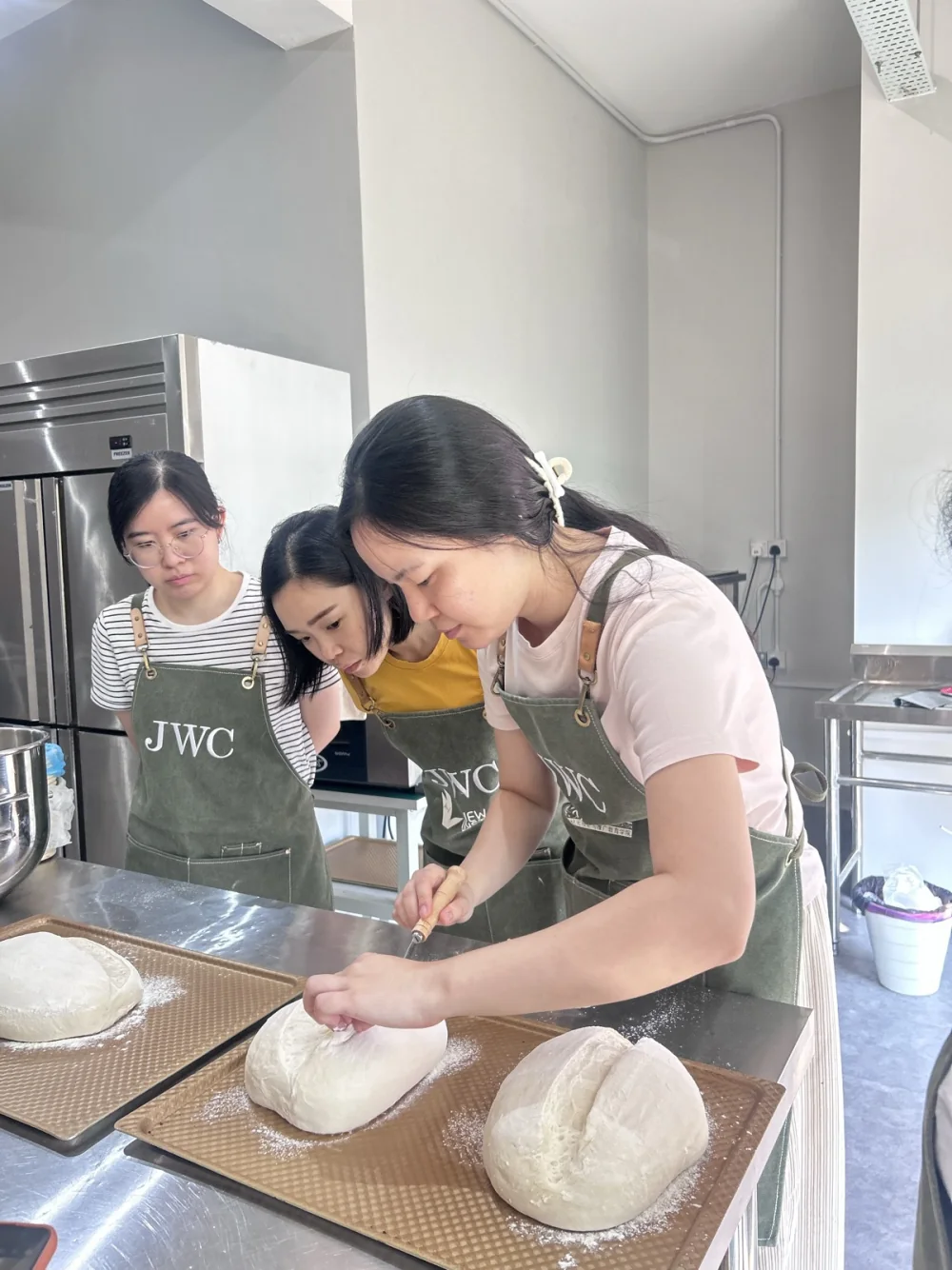 BWC learners observing and scoring sourdough before baking